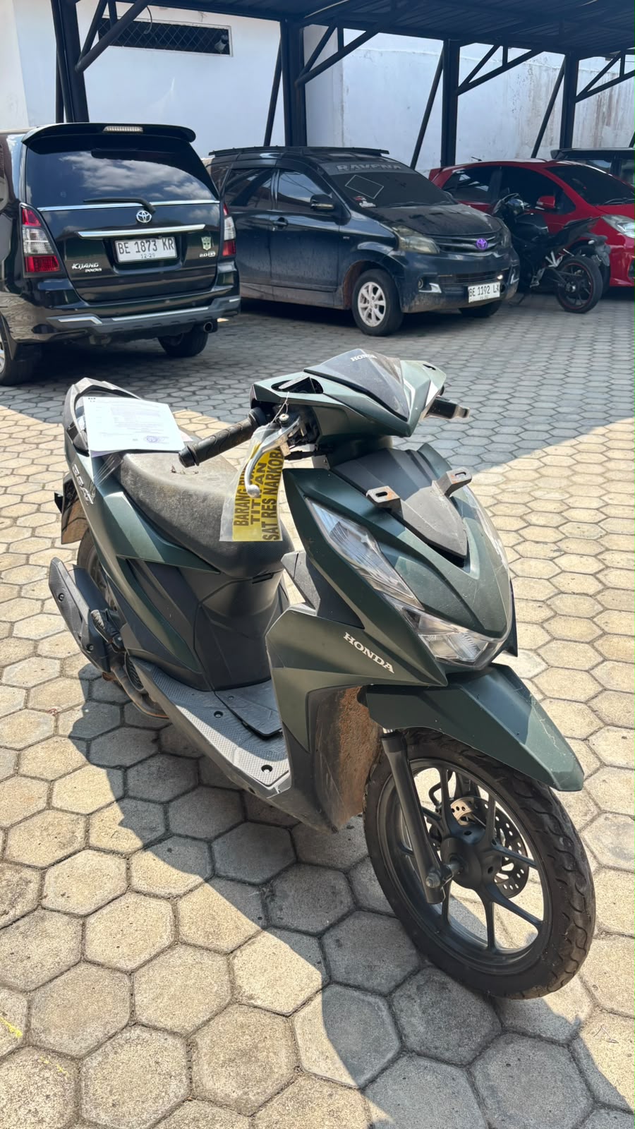  1 (satu) unit sepeda motor Merk Honda Beat warna hijau dengan No. Rangka MH1JM9123PK974271 dan No. Mesin JM91E2974814