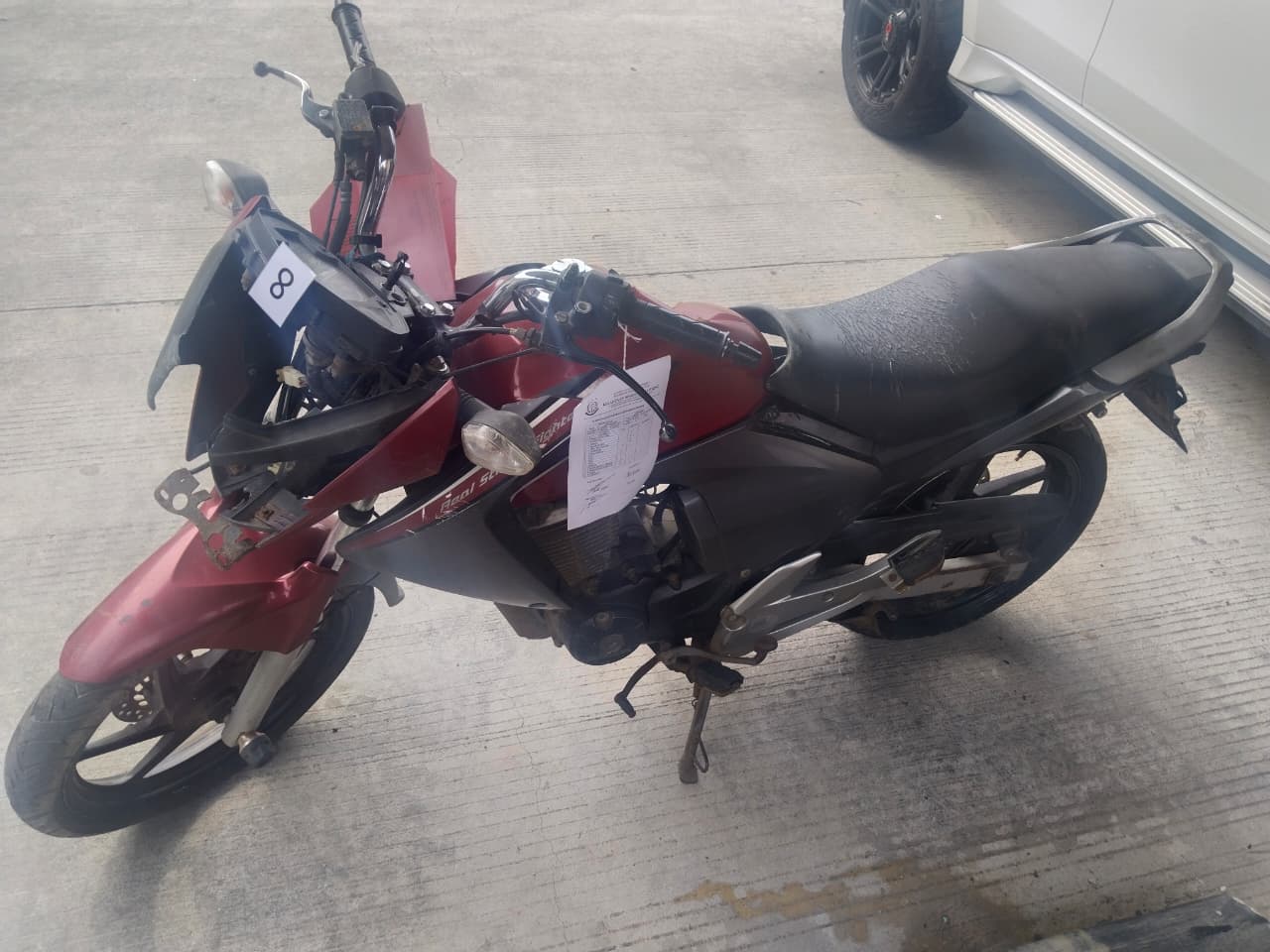 1 (satu) unit Sepeda Motor  Merk Honda Mega Pro  warna Merah Hitam  dengan No. Mesin :  KC31E1104886 No.  Rangka :  MH1KC3119BK109115  Tanpa dilengkapi No.  Polisi dan Surat Surat  Kendaraan Bermotor,  Beserta Kunci Kontak  sepeda Motor.