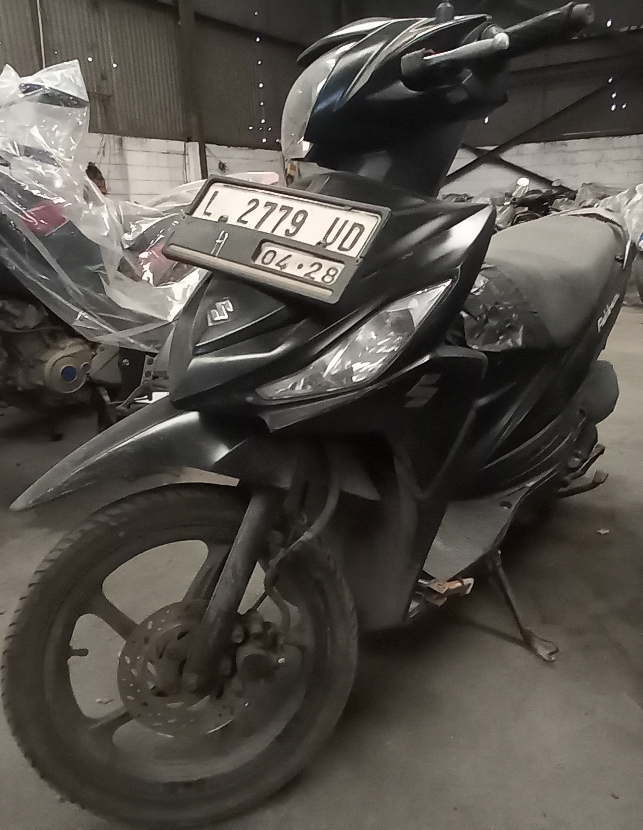 1 (satu) unit sepeda motor suzuki address warna hitam No.Pol L-2779 UD