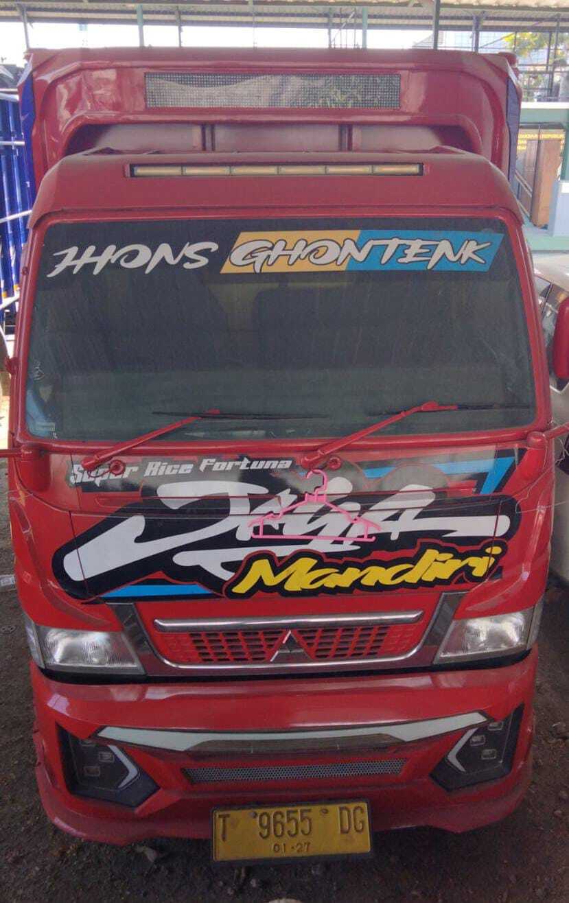 1 (satu) unit Kendaraan truck merk Mitsubishi warna kuning Nopol T 9655 DG