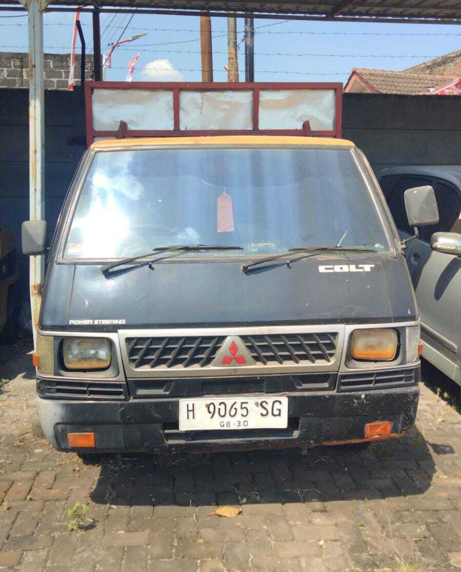 1 (satu) unit kendaraan Pick Up merk Mitsubishi Colt L300 warna hitam dengan Nopol H 9065 SG