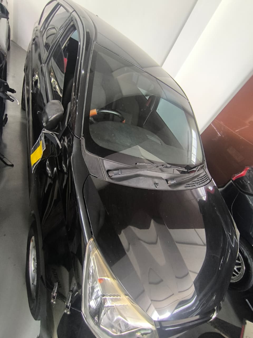 Kendaraan Daihatsu Sigra warna hitam Nomor polisi BM 1824 HC;