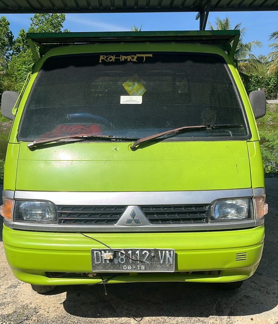 1 unit mobil pick up merk Mitsubishi berwarna hijau dengan nopol DN 8112 VN dengan nomor mesin 4G15-J42416 dan Nomor Rangka MHMU5TU2EDK108213 beserta Kuncinya