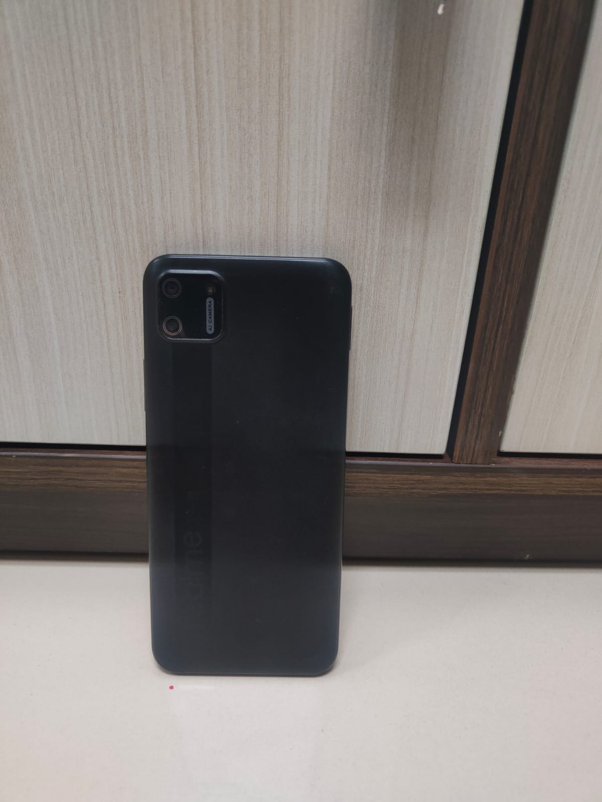 1 (satu) buah HP warna hitam merk realme C11 dengan nomor HP 088225910927